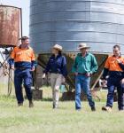 Landholder and Powerlink staff walking together at a property